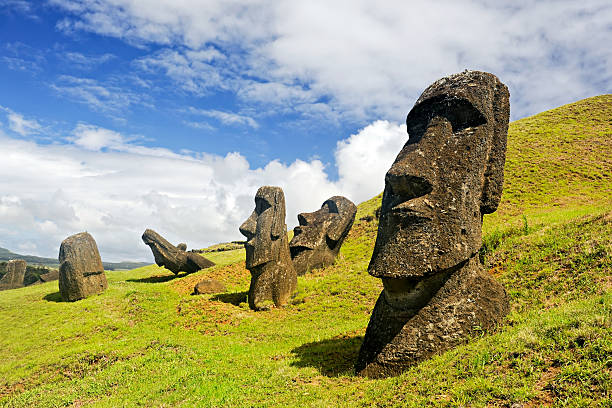 Chile - February 6, 2012: Moais in Rapa Nui National Park on the slopes of Rano Raruku volcano on Easter Island, Chile. easter island stock pictures, royalty-free photos & images