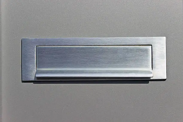Mail-slot on silver post box