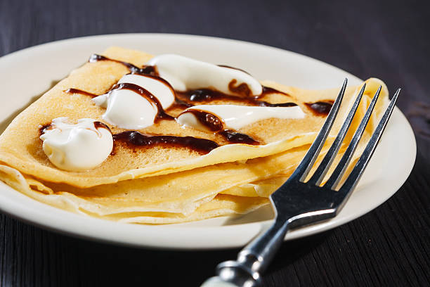 istock Closeup of chocolate pancakes with whipped cream 466025729