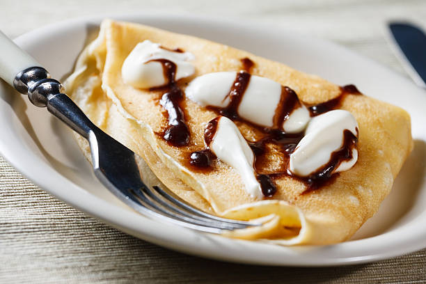 istock French style crepe with cream and chocolate sauce 466025739