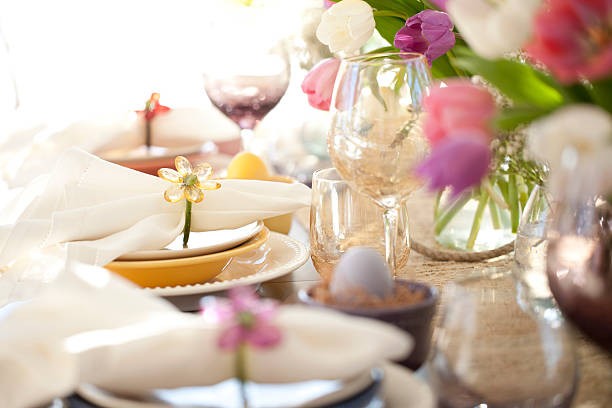 istock Easter dining table, bouquet of tulips and lovely place setting 466027352