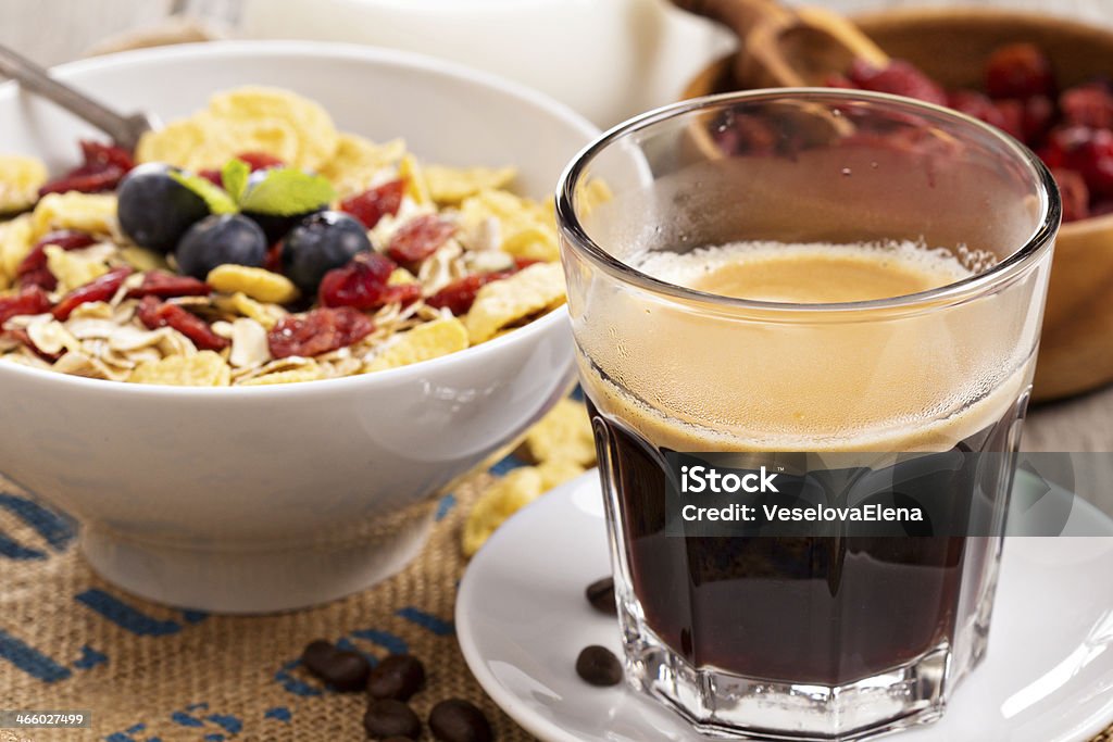 Coffee for breakfast with granola Breakfast with homemade granola with seeds and berries Berry Fruit Stock Photo