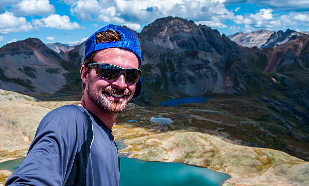 istock Happy Mountain Climber Standing On Top of Peak 466029202