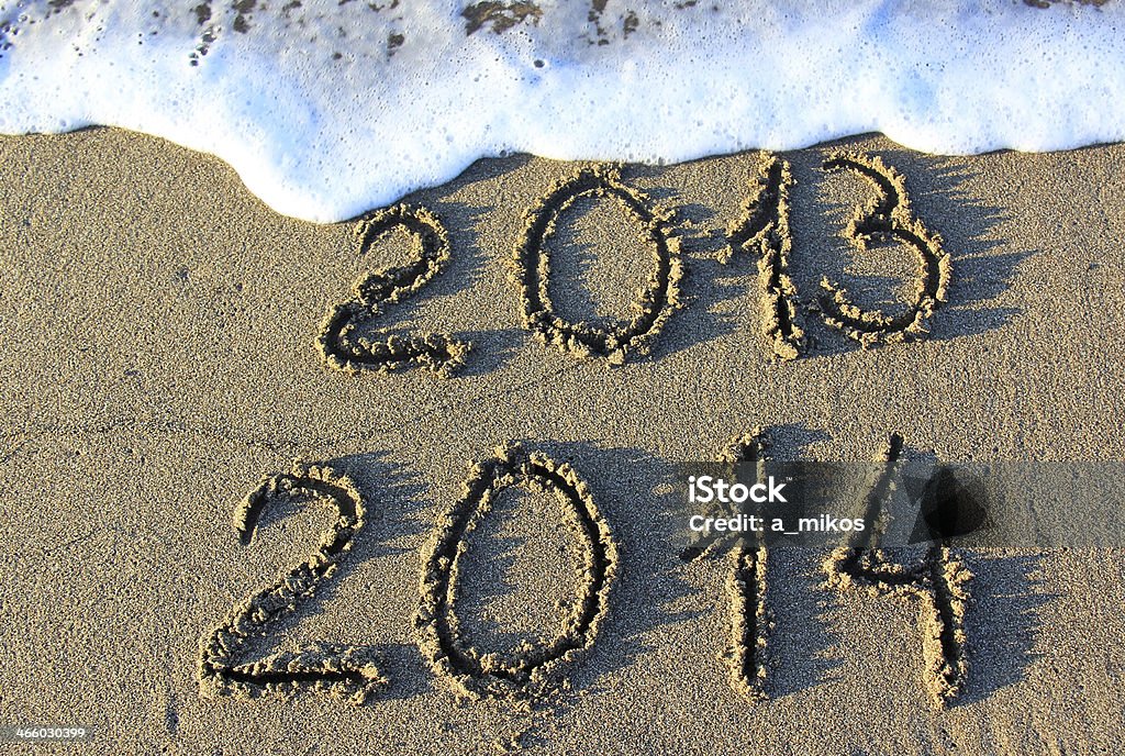 Happy New Year Happy New Year 2014 replace 2013 concept on the sea beach 2013 Stock Photo
