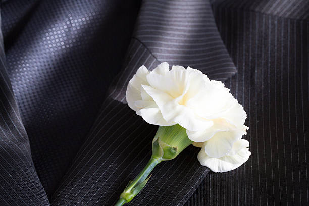 Wedding flower white carnation on a jacket lapel buttonhole flower stock pictures, royalty-free photos & images