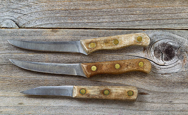 istock Vintage knives on rustic wood 466032504