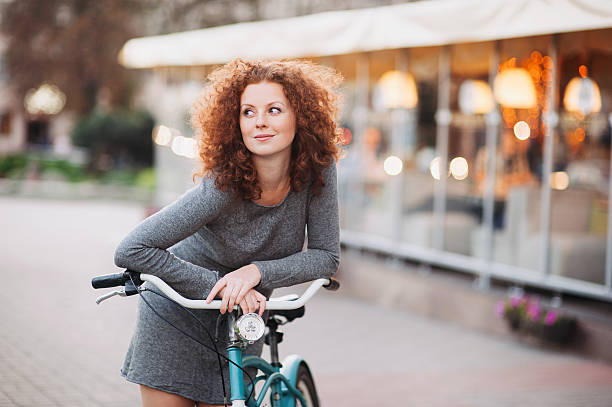 istock Beautiful woman with bike 466032910