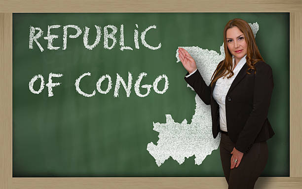 istock Teacher showing map of congo on blackboard 466033524