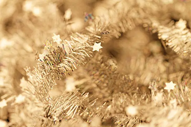 Yellow tinsel Christmas decoration - close-up photo