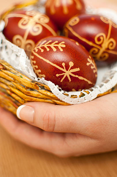 istock Woman hands holding dyed traditional easter eggs 466034636
