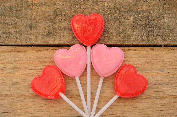 istock Red and pink heart shaped lollipops 466034714