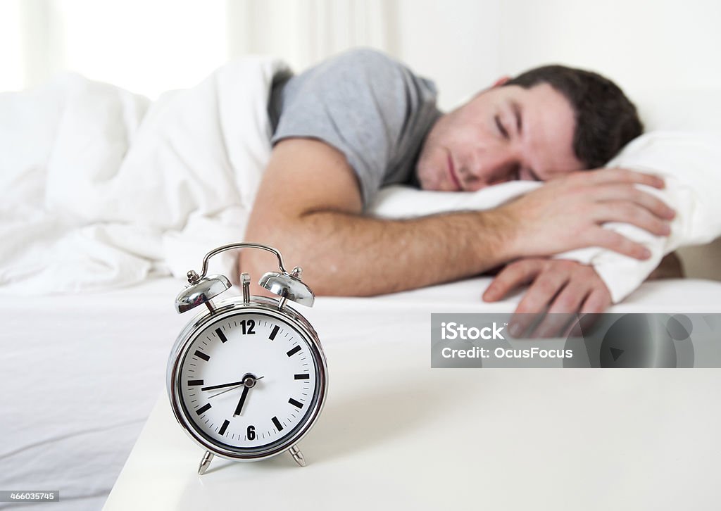 Young attractive man sleeping on bed Young attractive man sleeping on bed early morning Adult Stock Photo