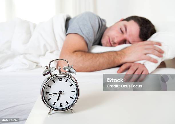 Young Attractive Man Sleeping On Bed Stock Photo - Download Image Now - Adult, Alarm Clock, Beautiful People
