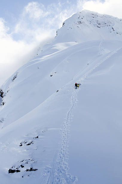 istock Snowboarder ascending for free ride 466036383