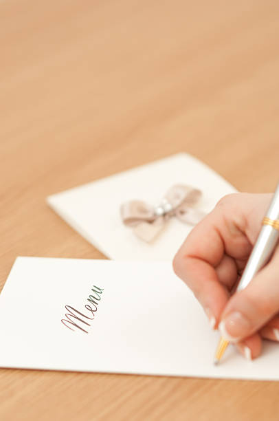 istock Woman writing on a wedding menu 466037086