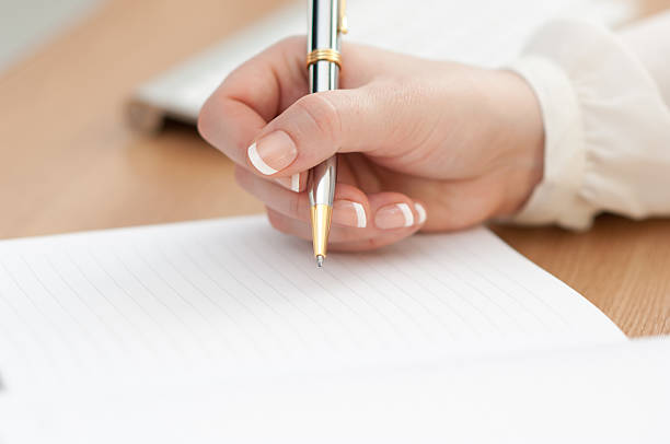 istock Close-up shot of a woman's hand writing her schedule 466037142
