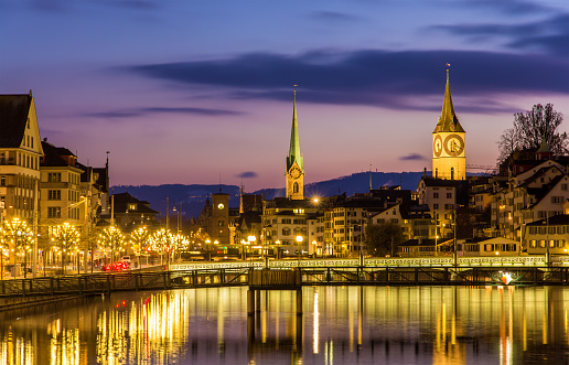 Zurich on banks of Limmat river on a winter evening