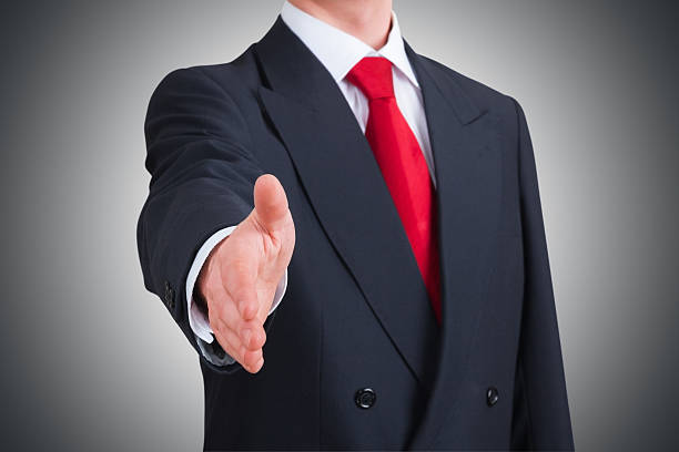 istock young businessman offering to shake hands 466037946