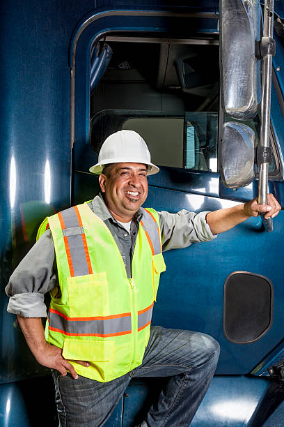 istock Truck driver in hard hat and neon vest 466038725