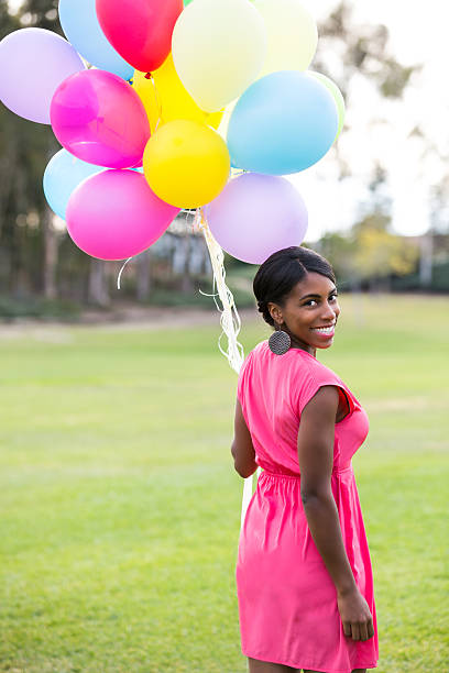 istock Girl with colorful balloons 466039357