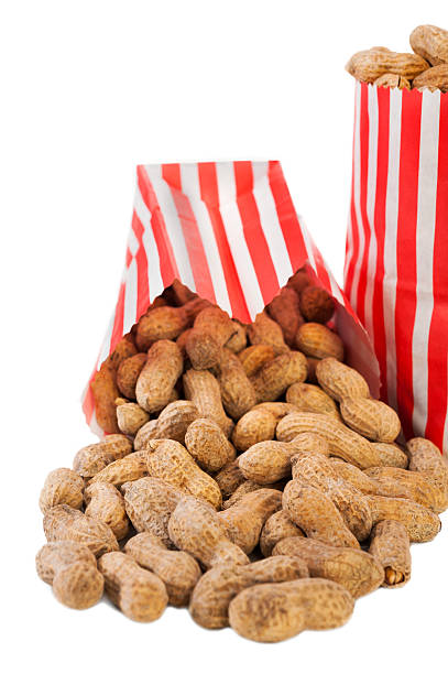 istock Roasted Peanuts in a red and white Paper Bag 466040997