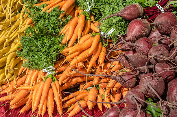 istock Fresh orange carrots on display at the market 466042078