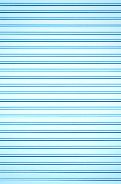 light blue corrugated metal sheet slide door stock photo