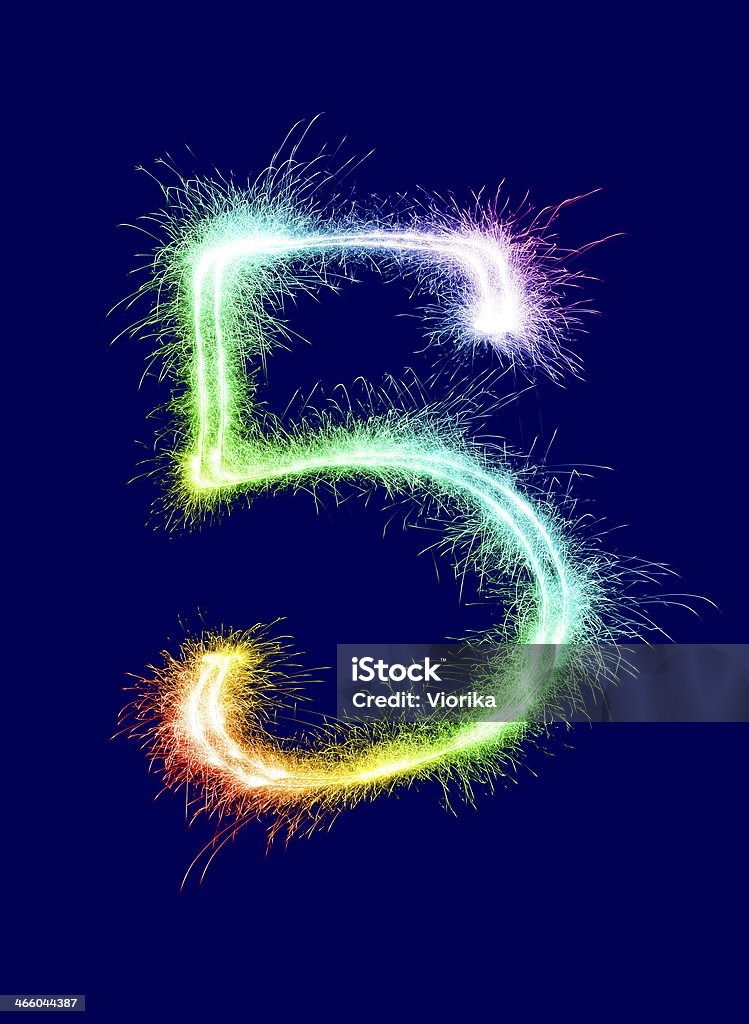 Sparkling Number 5 Sparkling multi colored number 5 on a blue background. Can be used for birthdays, anniversaries. Anniversary Stock Photo