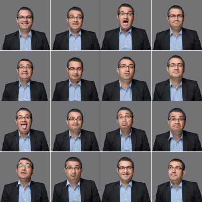 Real man multiple expressions on gray background, studio shot