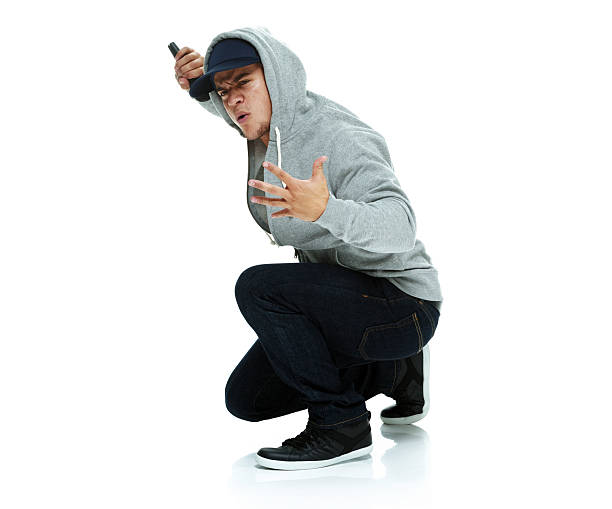 istock Rapper holding in action with microphone 466045462