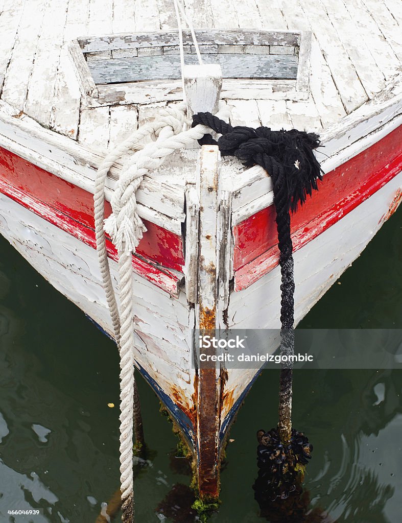 Small old boat vintage style Typical croatian old small boat in the sea. Selective focus. Croatia Stock Photo