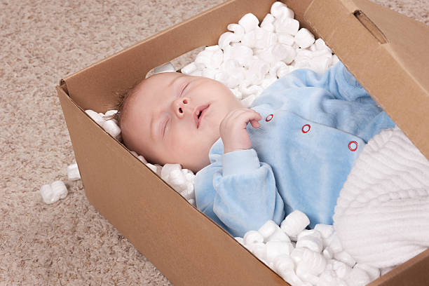 istock Newborn baby in open post box 466050294
