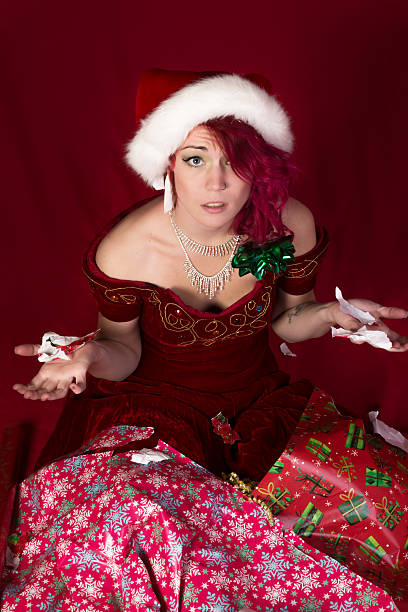 istock Santa's Elf lost in wrapping paper. 466050445