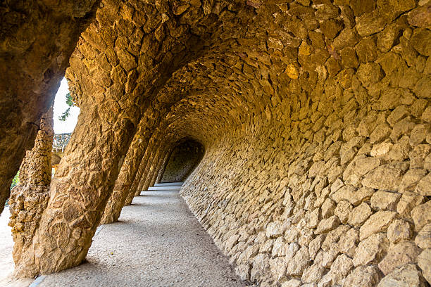 There is a view of the part of Park Güell, a public park system composed of gardens and architectural elements located in Barcelona, Catalonia, Spain. The designer and architect is  Antoni Gaudí. The picture has been taken in Summer 2020, daylight time.