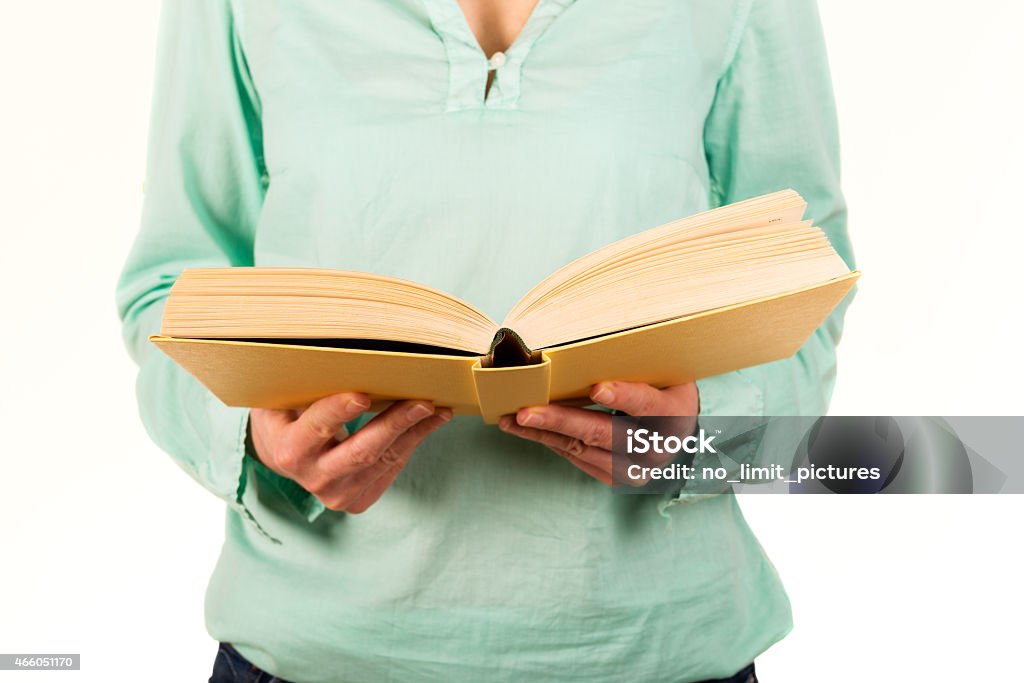 woman reading in a book woman is reading in a book 2015 Stock Photo