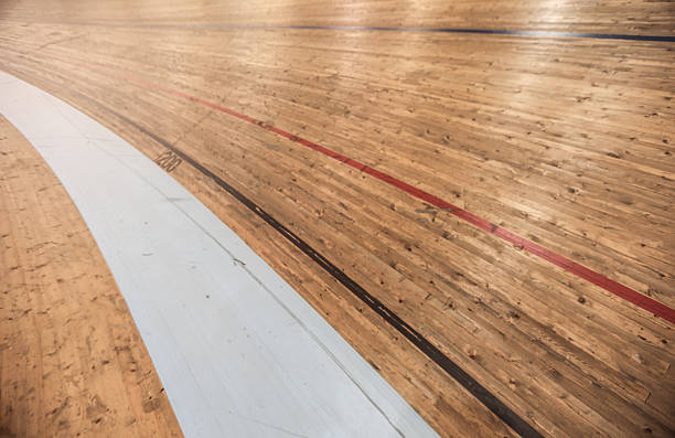 Velodrome track wooden track surface for an indoor velodrome venue for cycling. This oval track is used for indoor cycling competitions and events. velodrome stock pictures, royalty-free photos & images