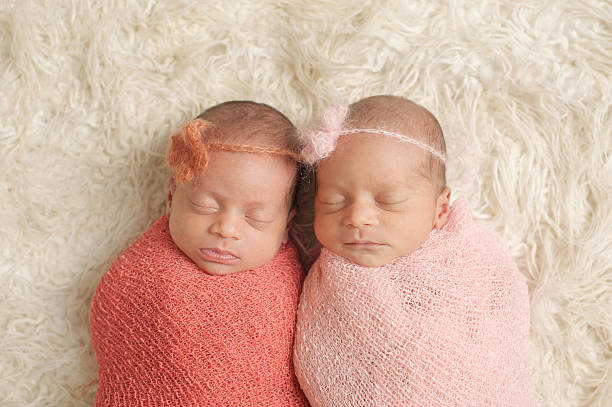 istock Sleeping Newborn Twin Girls 466051333