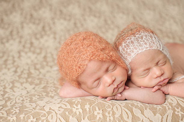 istock Sleeping Newborn Twin Girls 466051351