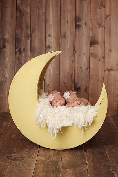 istock Sleeping Newborn Twin Girls 466051431
