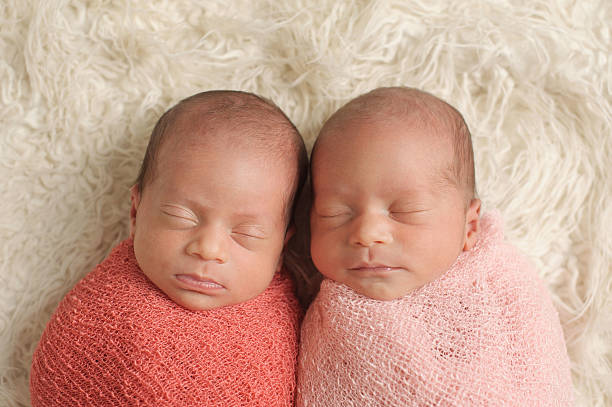 istock Sleeping Newborn Twin Girls 466051581