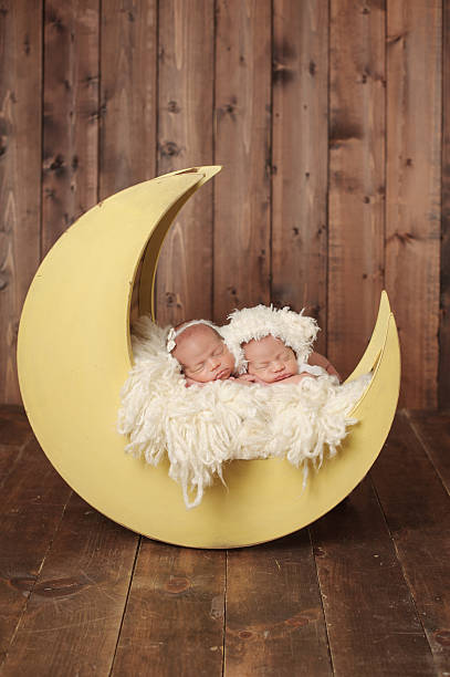 istock Sleeping Newborn Twin Girls 466051653