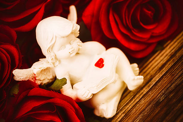 istock Cupid Cherub and Red Roses 466053085