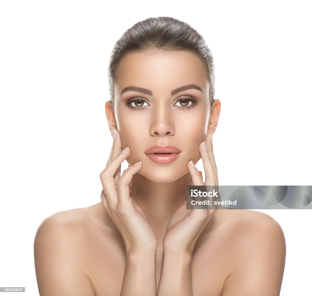 Beauty. Beautiful woman holding hands on her face and looking at camera. 20-29 Years Stock Photo