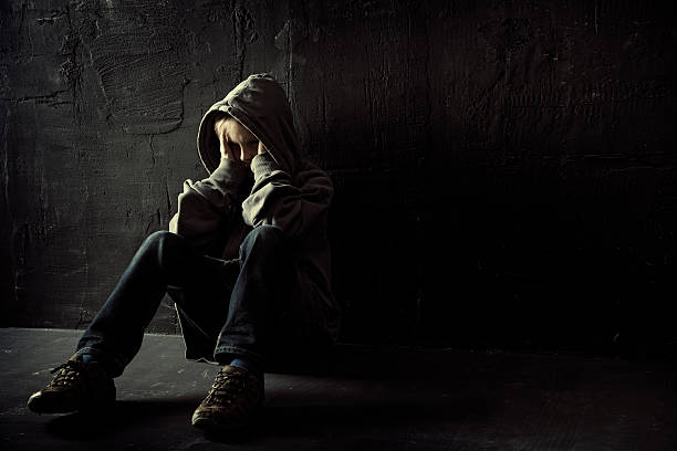 Loneliness Lonely boy sitting on the floor child crimes stock pictures, royalty-free photos & images
