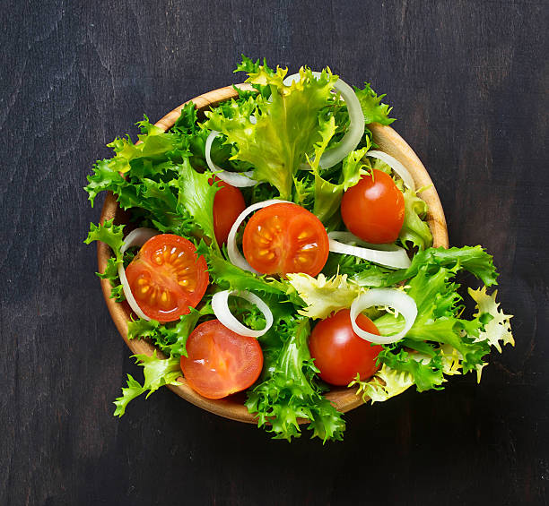 istock Fresh salad with tomato, frisee and onion 466054208
