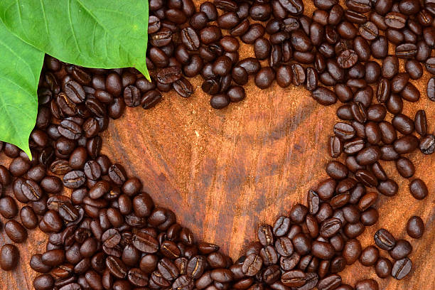 istock Roasted coffee beans on wood. (Arabica coffee) 466055025