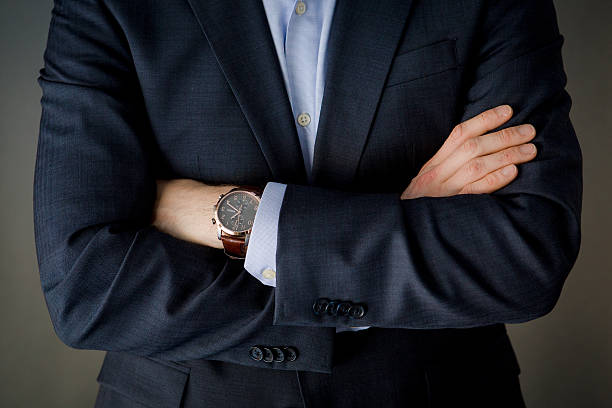 istock Business man in suit with folded arms wearing a watch. 466058162