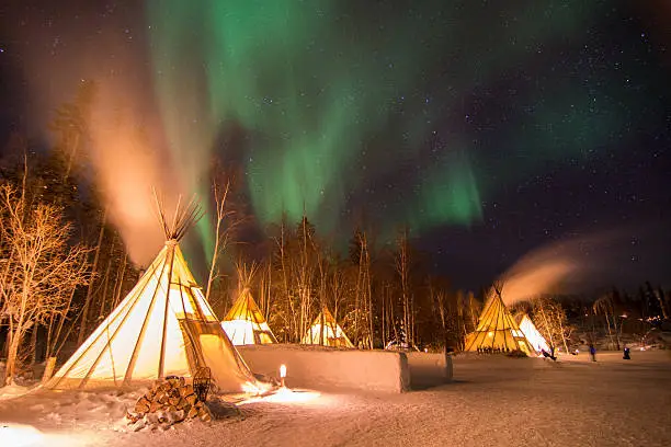 Aurora over scenes in Yellowknife, Canada