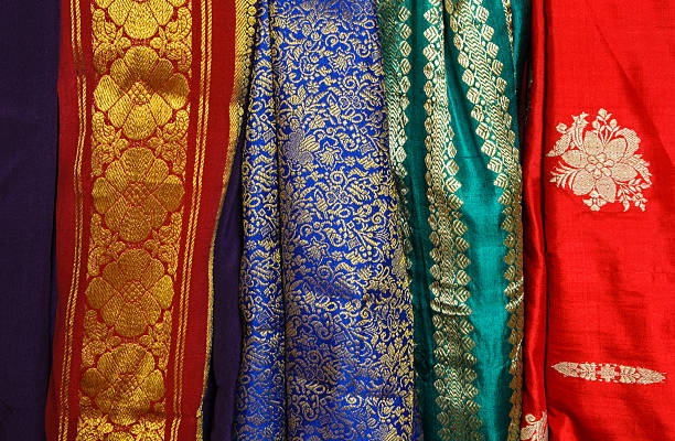 Colorful Sari Fabric Bright and colorful sari fabric hanging in a market india indian culture market clothing stock pictures, royalty-free photos & images