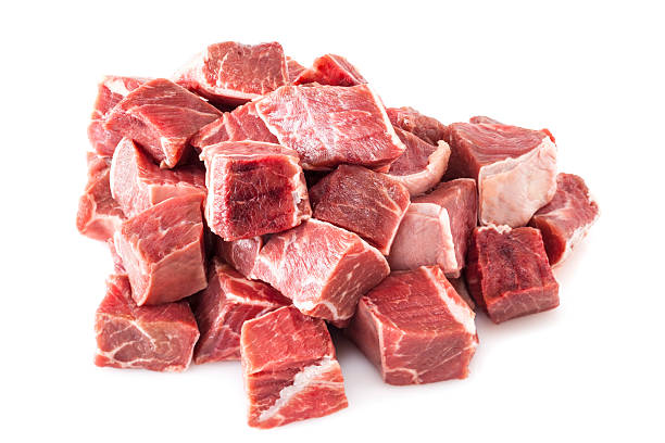 Beef Stew Meat Raw Beef Stew Meat Raw - diced raw blade or chuck steak, on white background. raw steak beef meat stock pictures, royalty-free photos & images